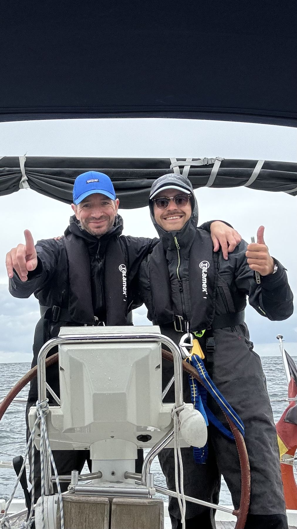 Felix and an instructor at the helm during offshore training